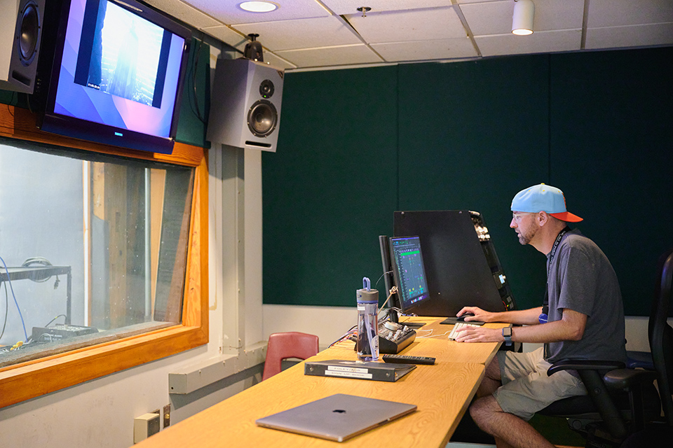 Faculty member and alumnus Clint Smith in the Foley Stage sound booth. / Photo: Wayne Reich