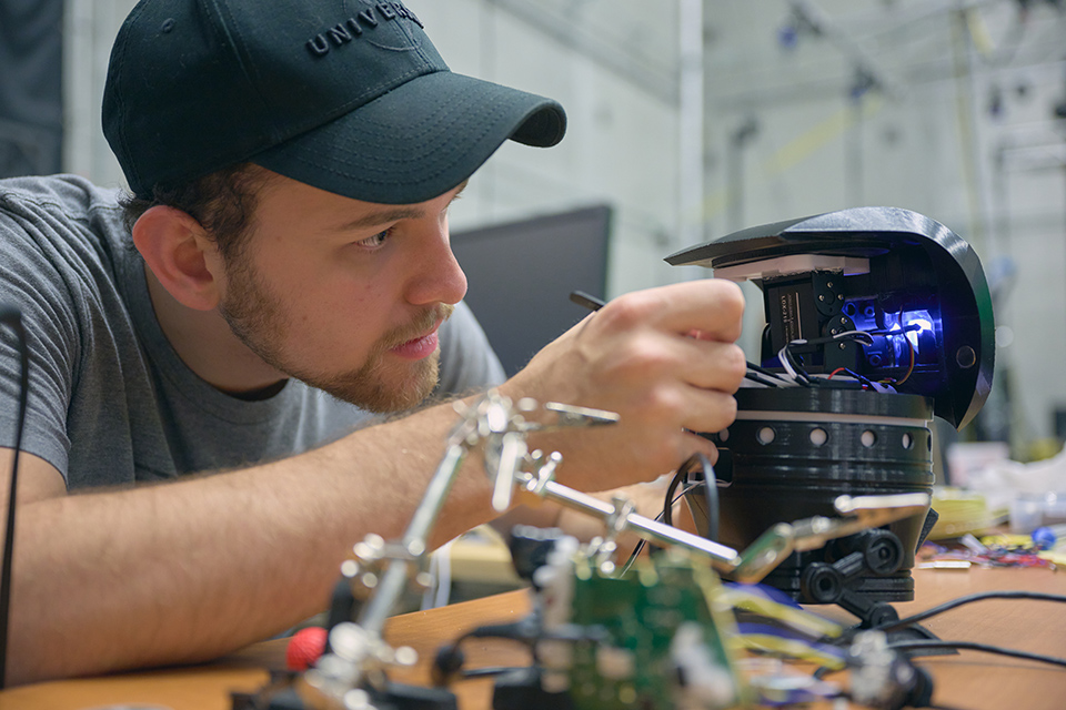 Film student programming robotics for film applications. / Photo: Wayne Reich